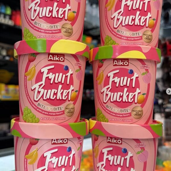 Stacked pink tubs of Aiko Fruit Bucket frozen dessert with green lids, imported