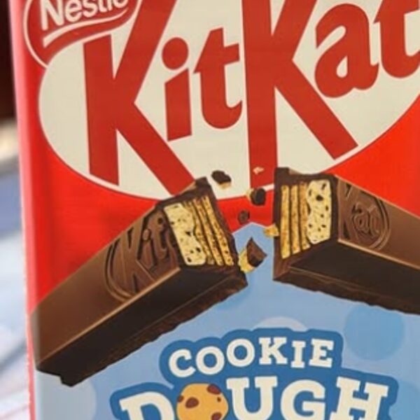 Nestle KitKat Cookie Dough bar in a red wrapper with a pale blue Cookie Dough band, imported from the United Kingdom